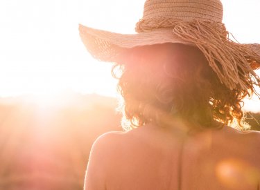 Back of a woman under the sun